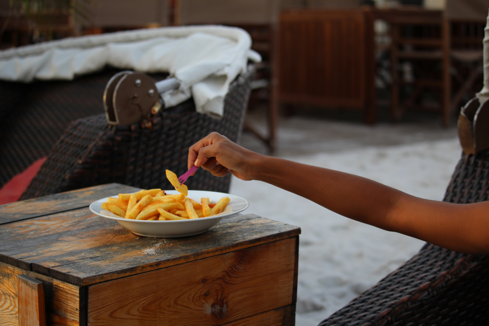 Hand with French fries