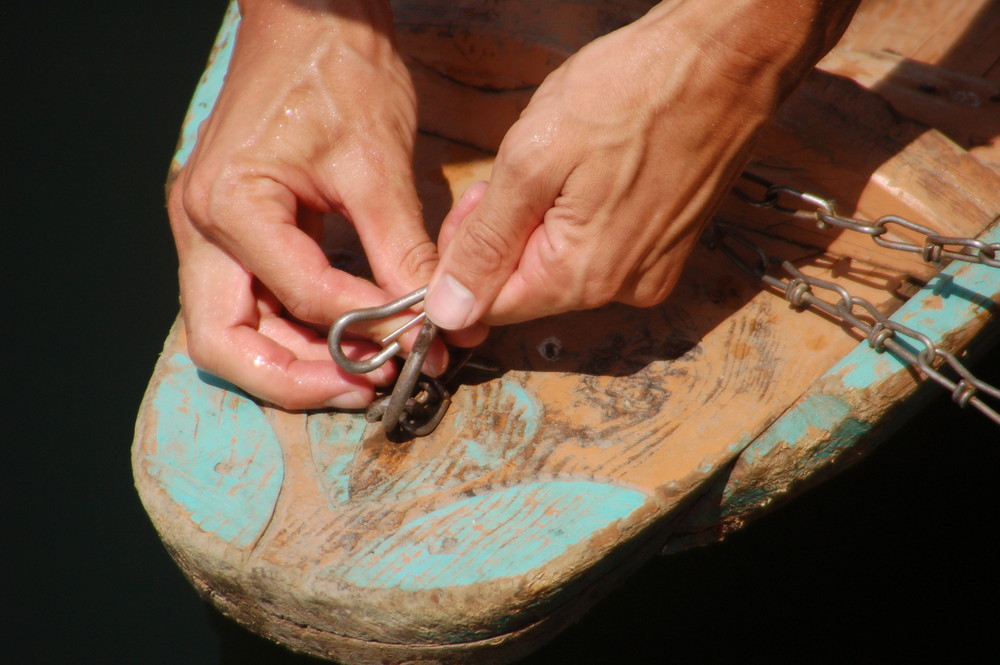 Hands in a boat