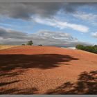 harrowed field of pink redstone soil near Dryburgh Scotland