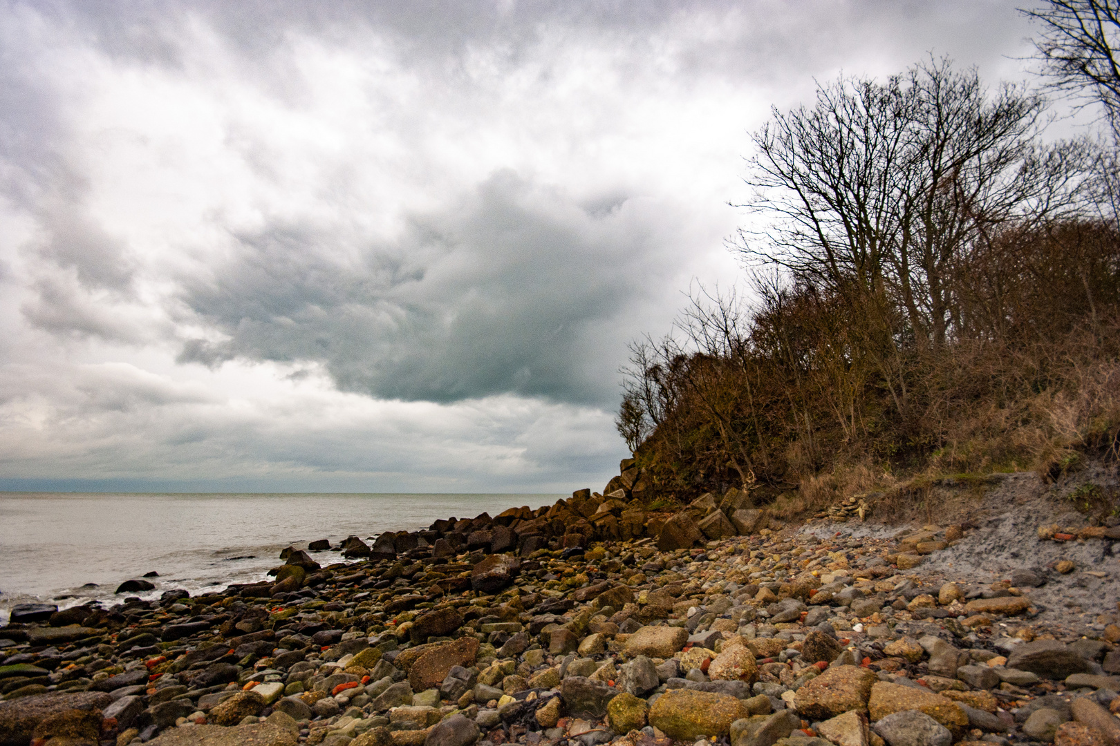 Headland and distant storm.