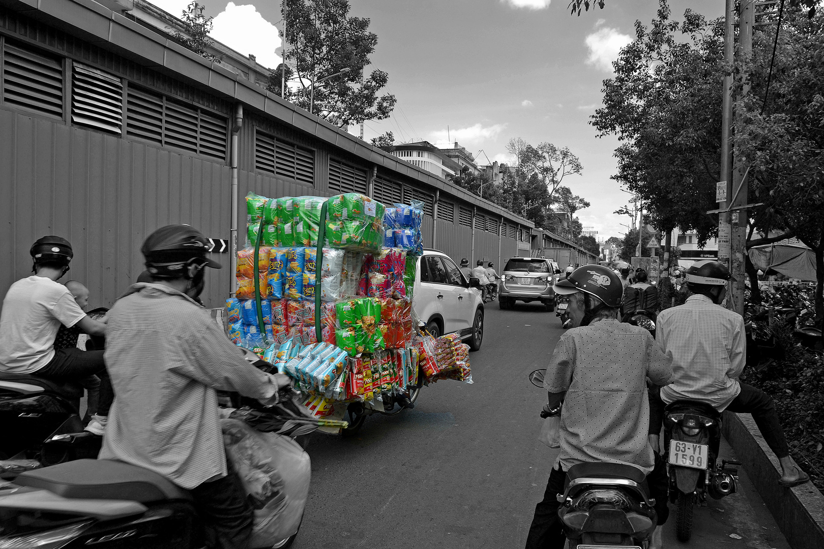 Heavy load on motorcycle in HCMC - Vietnam