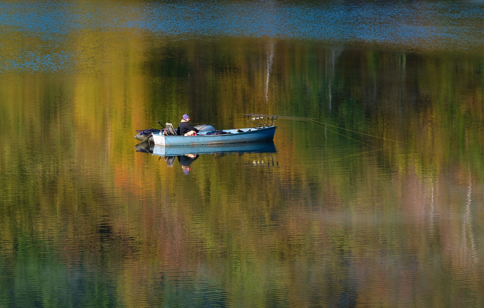 Herbst und Fischer am See