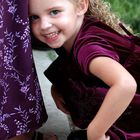 Hiding in Mommy's skirt.