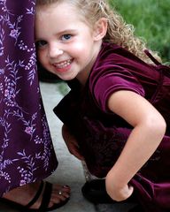 Hiding in Mommy's skirt.