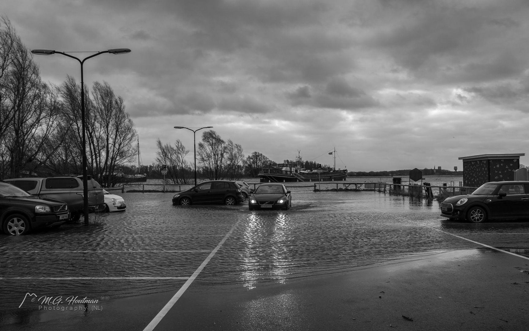 High water on the harbor parking lot Wijk bij Duurstede