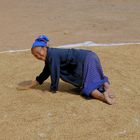 Hmong woman drying sticky rice