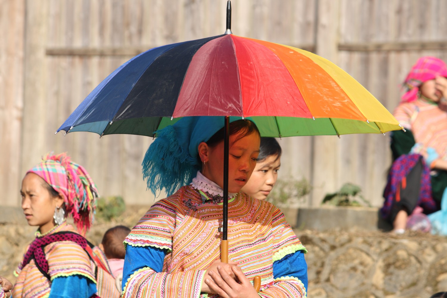 H'mong woman under umbrella