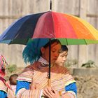 H'mong woman under umbrella