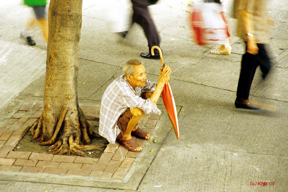 Hockender in Hong Kong