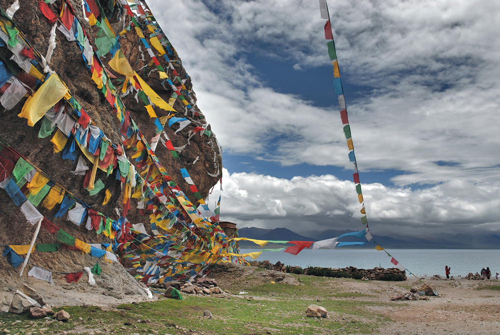 Holy rock covered with "dar cho" at the lake side