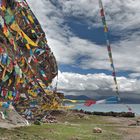 Holy rock covered with "dar cho" at the lake side