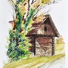 Holzhütte mit Baum