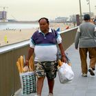 hungry man at barcelona beach