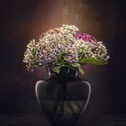 Hydrangea flower bouquet in glass vase