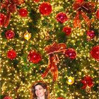 i saw her standing in front of huge x-mass tree in Singapore