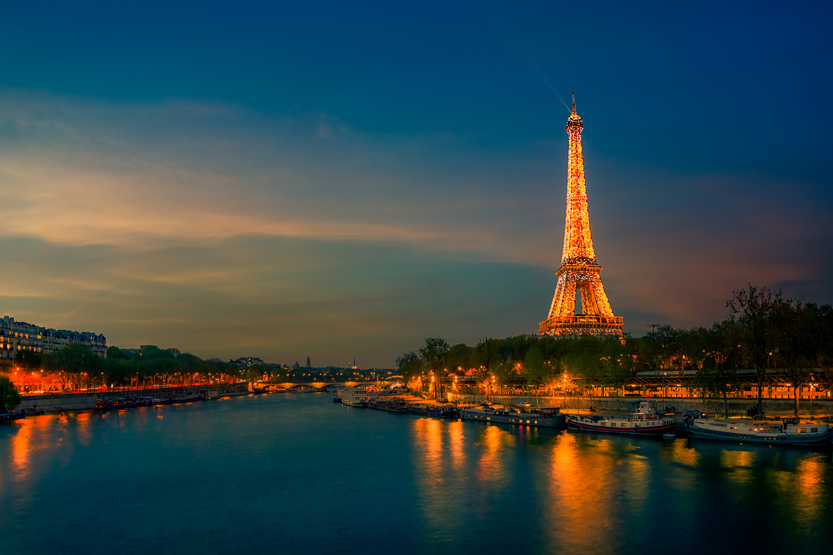 Illuminated Eiffel Tower during Sunset