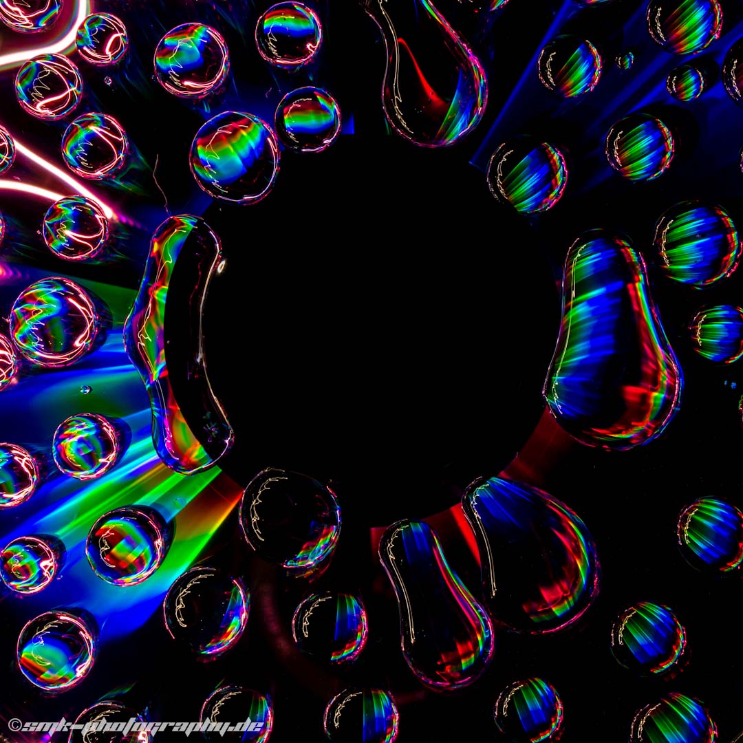illuminated waterdrops on a cd