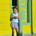 In front of an housedoor in the lane of Baracoa