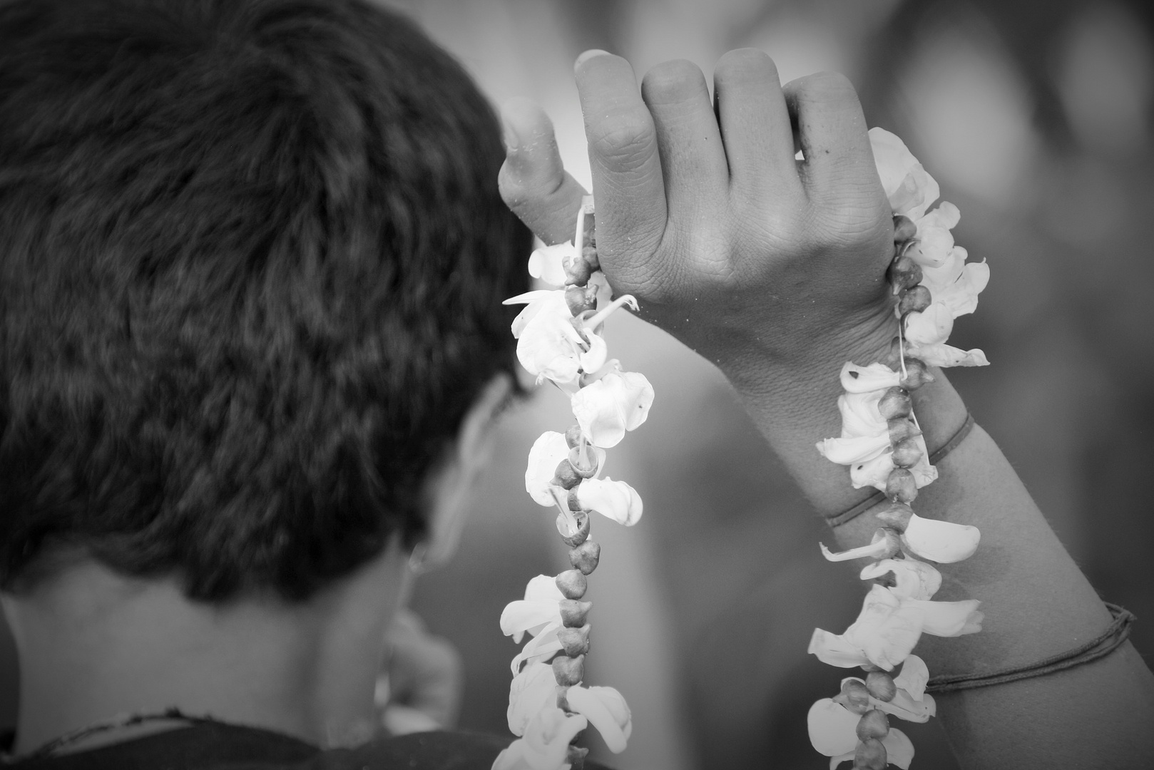 Indian boy selling flower Malas