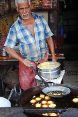 Indian Man at Street Kitchen