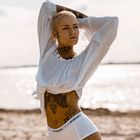 inked girl at the beach
