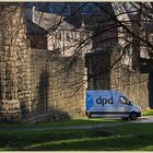 internet delivery van cutting through the medieval city walls of newcastle