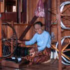 Intha lady spins the silk thread