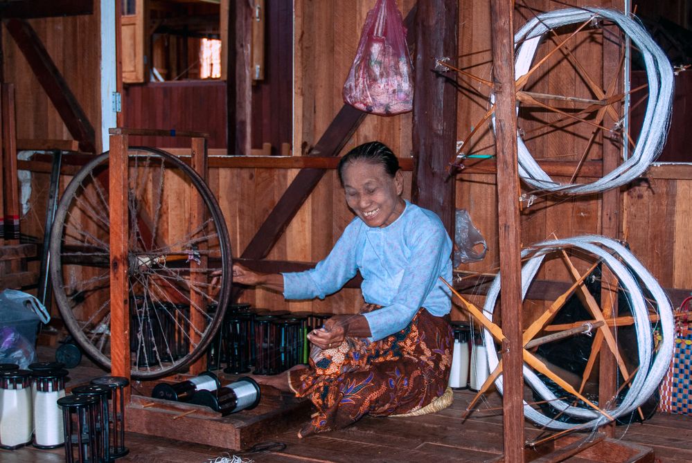 Intha lady spins the silk thread