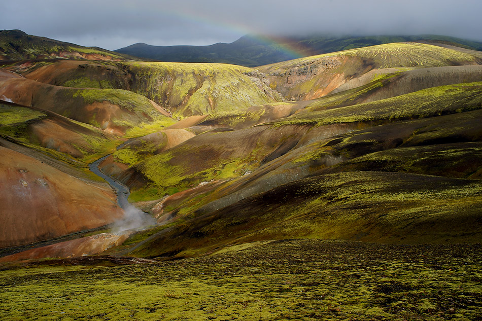Island Farborgie mit Regenbogen im südlichen Hochland