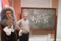 Issac Newton & Albert Einstein