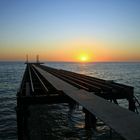 Jetty, Eisenbrücke . Sonnenuntergang