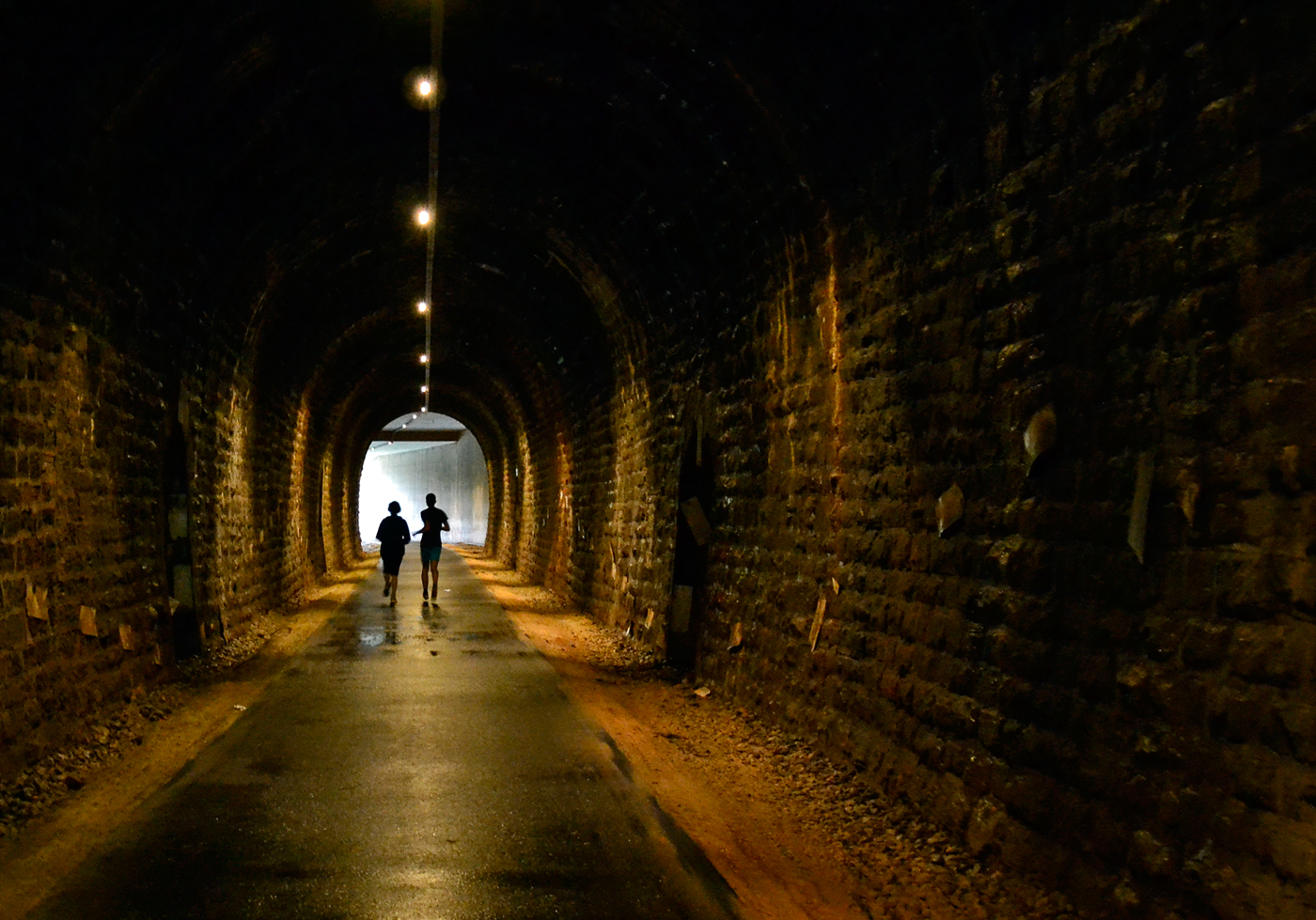 joggers in old railwaytunnel