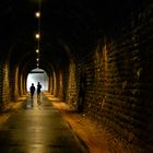 joggers in old railwaytunnel