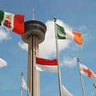 Juxtaposition of Tower Of The Americas in San Antonio, Tx. and all flags flown in Texas.