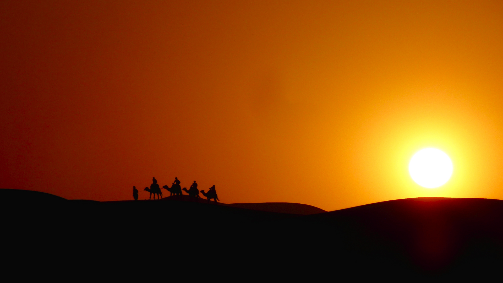 Kamelritt im Erg Chebbi bei Sonnenuntergang