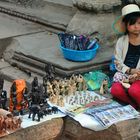 Khmer kid sells souvenir in Prasat Ta Prohm