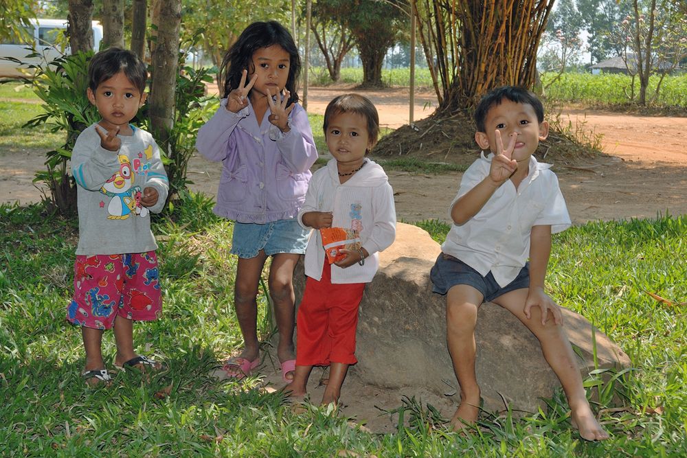 Kids greeting in front of the silk manufacture