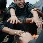 Kids next to fire