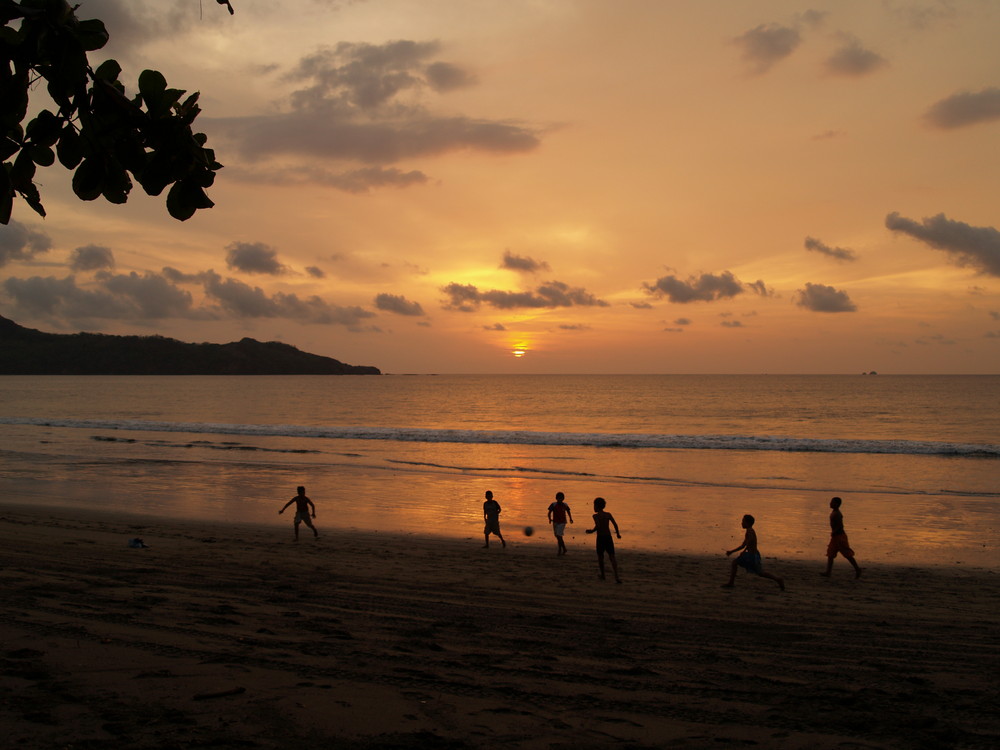 Kids playing football.