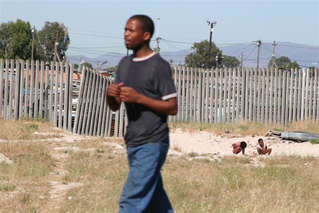 Kids taking a dump in the sand-Township near Capetown