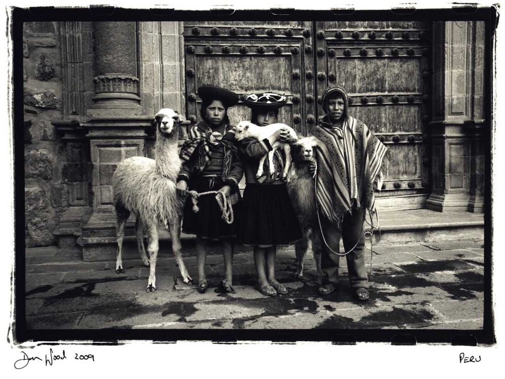 Kids with lamas,Peru