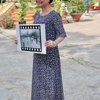 Kim Phuc and the photo THE TERROR OF WAR in Trang Bang, Vietnam Photo Peter Scheid