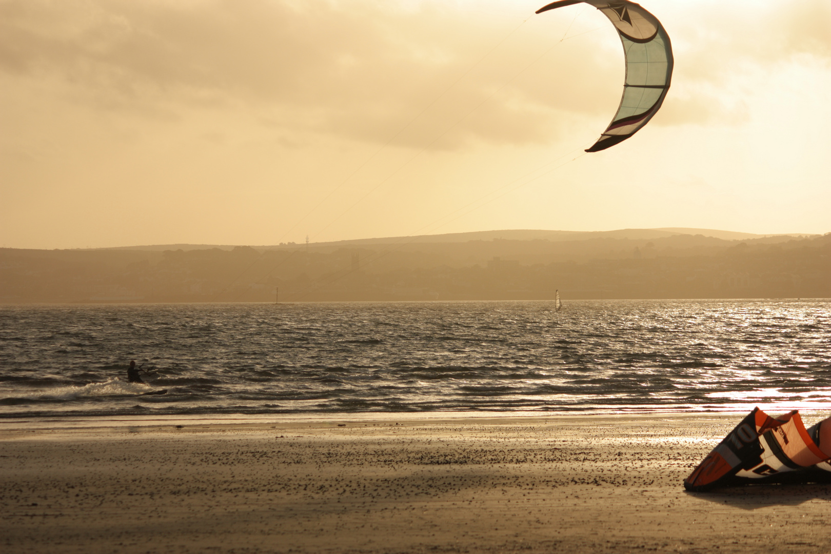 Kite surfer at sunset