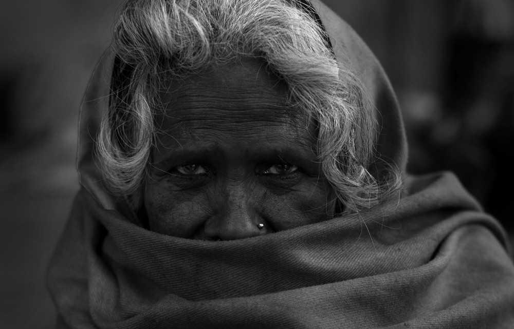 Kumbha Mela 2010, Old woman seeking shelter at an Akhara, Harald Keller