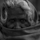 Kumbha Mela 2010, Old woman seeking shelter at an Akhara, Harald Keller