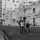 La Habana XVIII, ...skaters race in the evening on the Malecon.