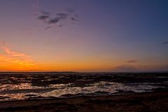 La plage de Ronce-les-Bains à marée basse après le coucher du soleil