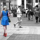 Lady in blue with red shoe