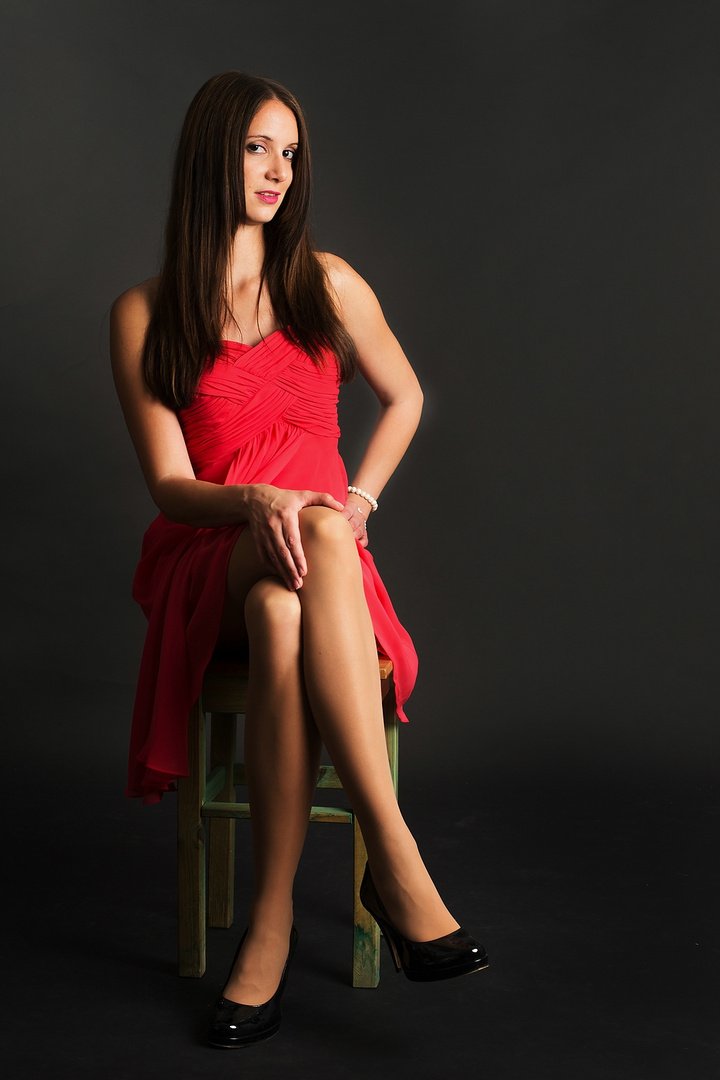 Lady in red sitting