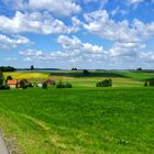 Landschaft mit Bauernhof